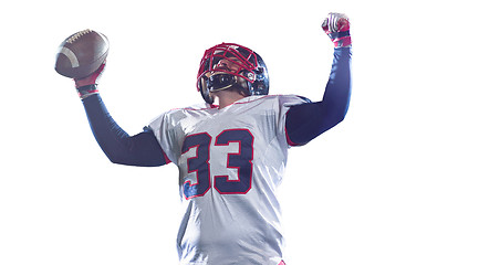 Image showing american football player celebrating after scoring a touchdown