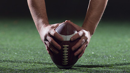 Image showing American football player starting football game