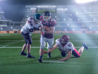 Image showing Front view of American football players in action