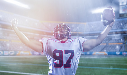 Image showing american football player celebrating after scoring a touchdown