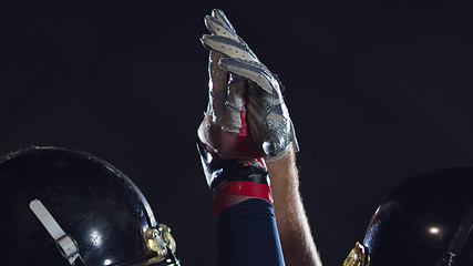 Image showing american football players celebrating after scoring a touchdown