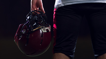 Image showing rear view of young confident American football player