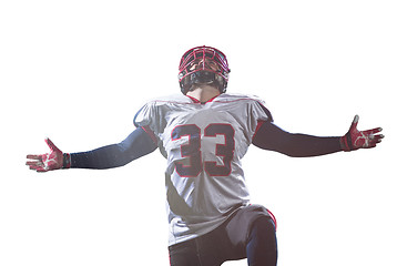 Image showing american football player celebrating after scoring a touchdown