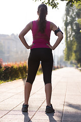 Image showing woman jogging at sunny morning