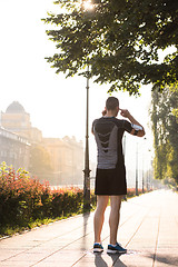 Image showing man jogging at sunny morning