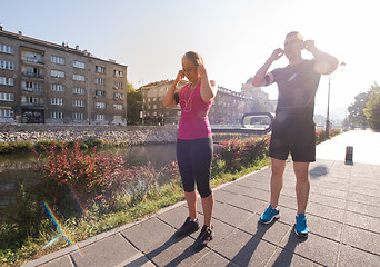 Image showing young couple jogging  in the city