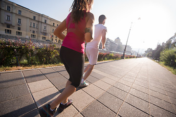 Image showing young couple jogging  in the city