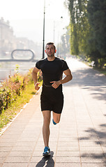 Image showing man jogging at sunny morning