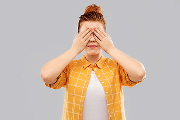 Image showing red haired teenage girl in checkered shirt