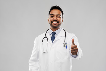 Image showing smiling indian male doctor showing thumbs up