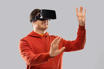 Image showing happy man in virtual reality headset or vr glasses