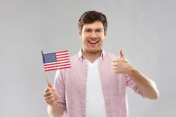 Image showing happy man with american flag showing thumbs up