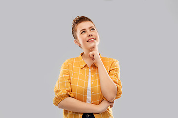 Image showing red haired teenage girl looking up and dreaming