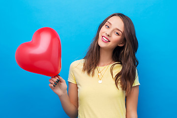 Image showing teenage girl with red heart-shaped balloon