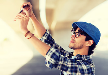 Image showing hipster man taking selfie on smartphone