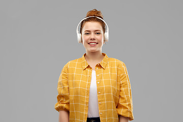 Image showing teenage girl in headphones listening to music