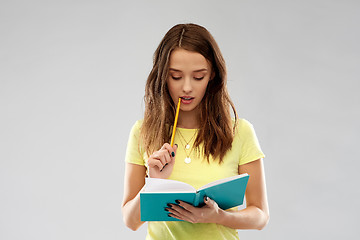 Image showing teenage student girl with diary or notebook