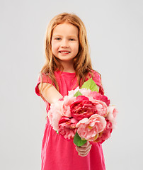 Image showing happy red haired girl with flowers