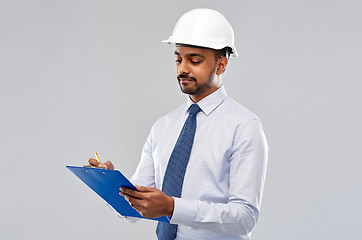 Image showing architect or businessman in helmet with clipboard