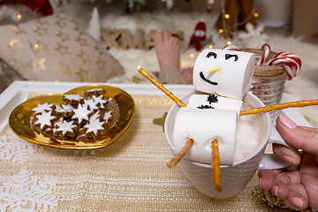 Image showing Merry snowman of marshmallow floats on a hot chocolate at Christ