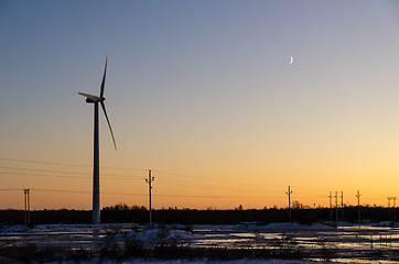 Image showing Windmill and power lines by sunset