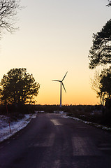 Image showing Windmill by sunset by a countryroad