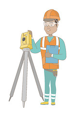 Image showing Hispanic surveyor builder working with theodolite.