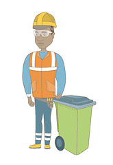 Image showing Young african-american builder pushing recycle bin