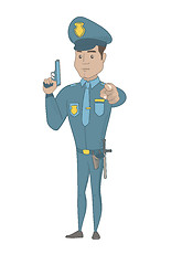 Image showing Young hispanic policeman holding a handgun.