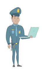 Image showing Young hispanic policeman using a laptop.