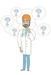 Image showing Thinking indian doctor with question marks.