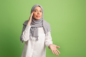 Image showing Argue, arguing concept. arab woman in hijab. Portrait of girl, posing at studio background