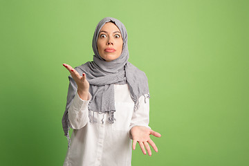 Image showing Argue, arguing concept. arab woman in hijab. Portrait of girl, posing at studio background