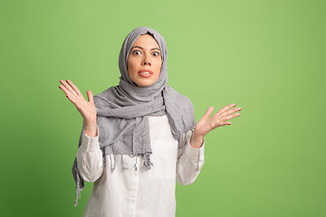 Image showing Argue, arguing concept. arab woman in hijab. Portrait of girl, posing at studio background
