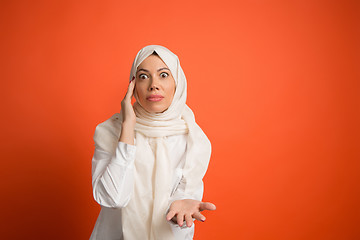 Image showing Argue, arguing concept. arab woman in hijab. Portrait of girl, posing at studio background