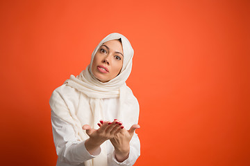 Image showing Argue, arguing concept. arab woman in hijab. Portrait of girl, posing at studio background