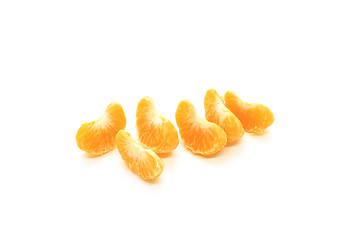 Image showing Tasty tangerine slices isolated on white background