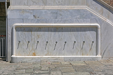 Image showing Row of Faucets