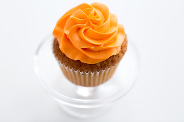 Image showing cupcake with frosting on confectionery stand