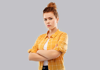 Image showing serious red haired teenage girl with crossed arms