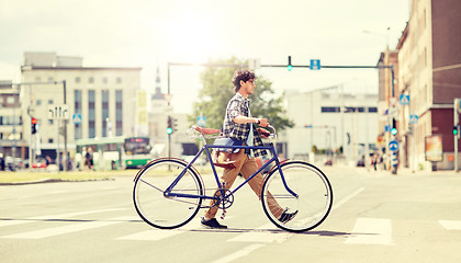 Image showing young man with fixed gear bicycle on crosswalk