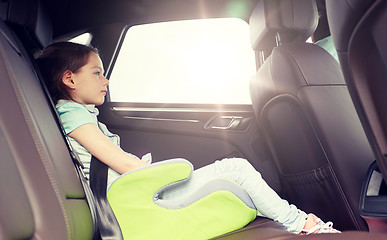 Image showing family with child in safety seat driving car