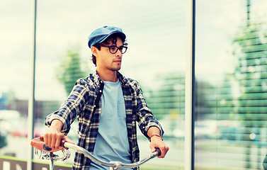 Image showing hipster man walking with fixed gear bike