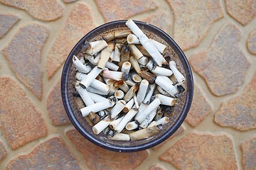 Image showing Cigarette buts in an ashtray