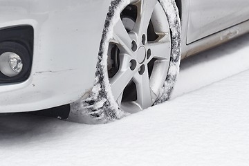 Image showing Car tyre in snow