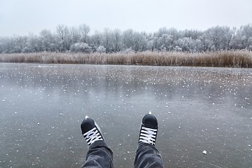 Image showing Skating on a lake