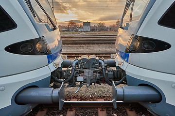 Image showing Train carriages connected at a station