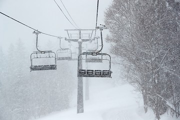 Image showing Ski lift in falling snow