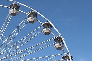 Image showing White ferris wheel against blus sunny sky