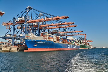 Image showing Loading containers on a ship